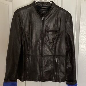 New without tags. Wilsons Leather soft Black Jacket with blue sleeve lining.